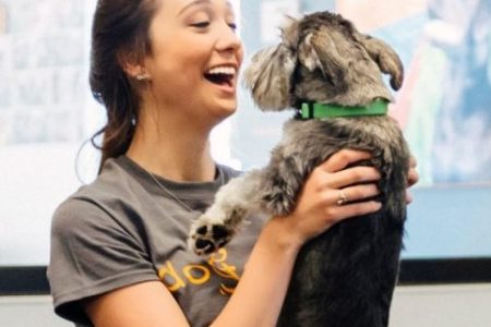 Woman with Happy Face Holding Dog