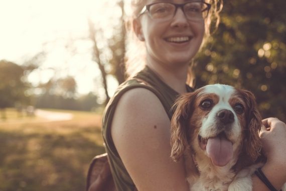 Happy dog owner and dog