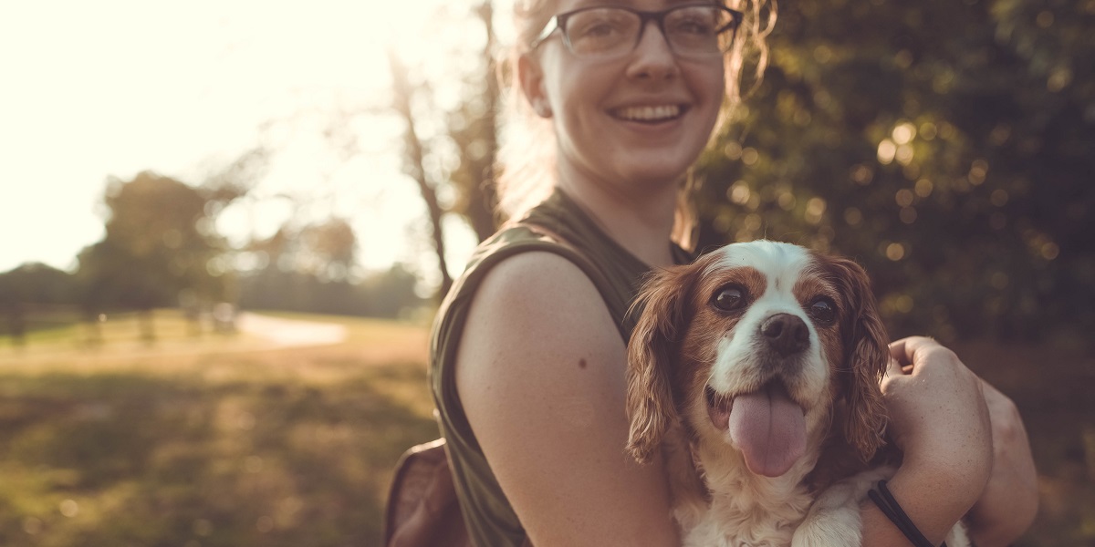 Happy dog owner and dog