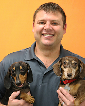 Aaron Mueller with Two Dogs