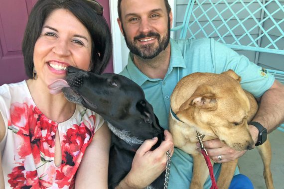 Dog mom Leanora, her husband, and their two dogs Cash and Carter