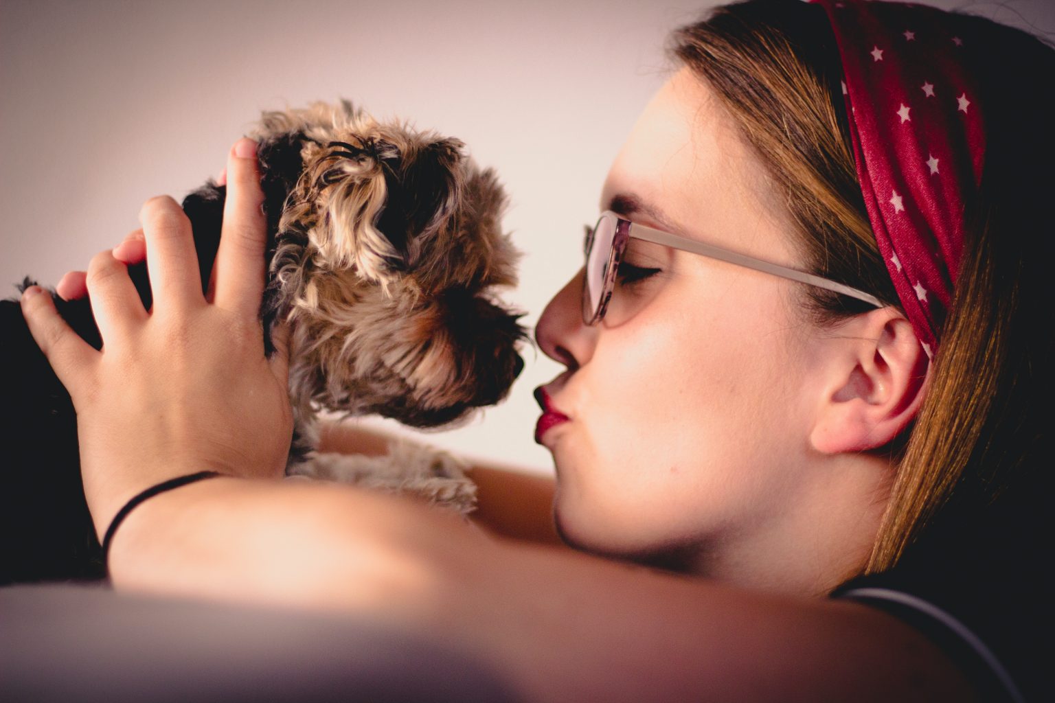 Woman holding small dog
