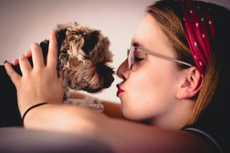 Woman holding small dog
