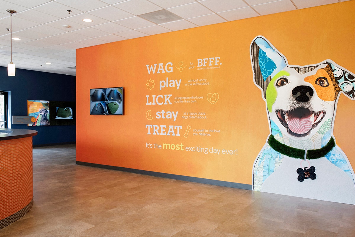 Welcome wall with the logo at Dogtopia lobby