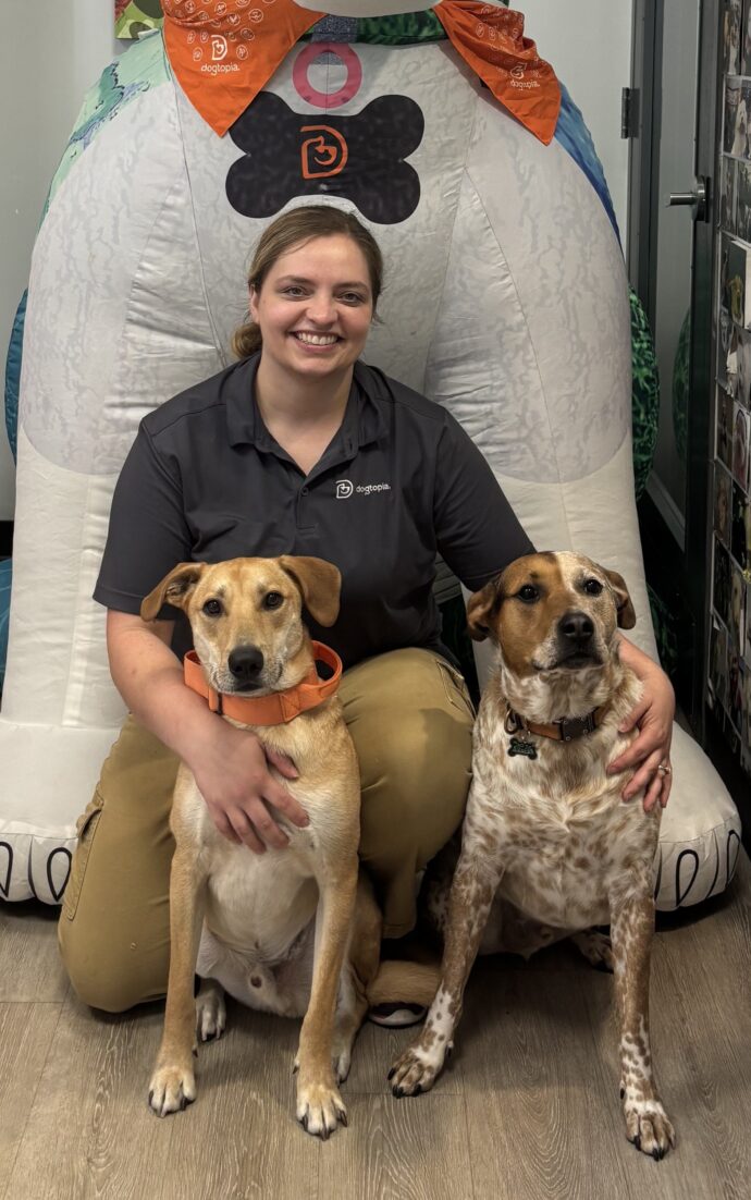 Store staff, regional manager, and her dogs