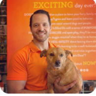 Owner of the store Nick Losciuto holding his dog proudly
