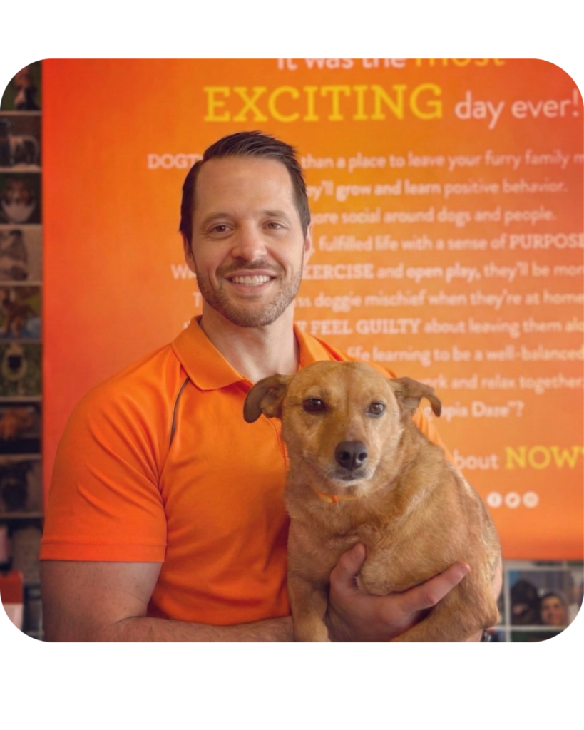 Owner of the store Nick Losciuto holding his dog proudly