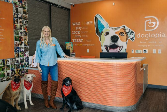 Diane Foos, Owner of Dogtopia of Rocklin, with her dogs in the lobby of her Dogtopia