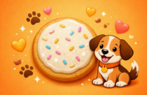 A cheerful cartoon dog sits beside a large frosted sugar cookie on a bright orange background. The cookie is round with white frosting and pastel sprinkles, surrounded by small paw prints, hearts, sparkles, and cookie crumbs. The dog has floppy brown ears, a tan and white coat, and a happy expression with its tongue out.