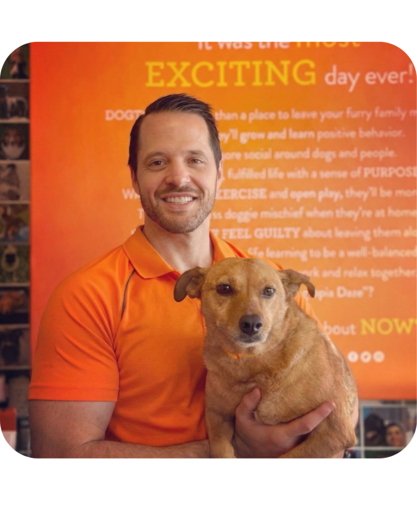 Owner of the store Nick Losciuto holding his dog proudly