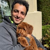 Toshin Makarh and his brown doodle Archie